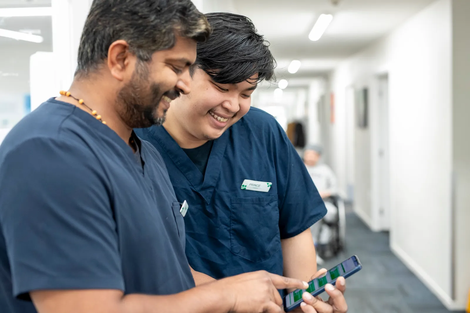 Two Aldwins House team members reviewing information together