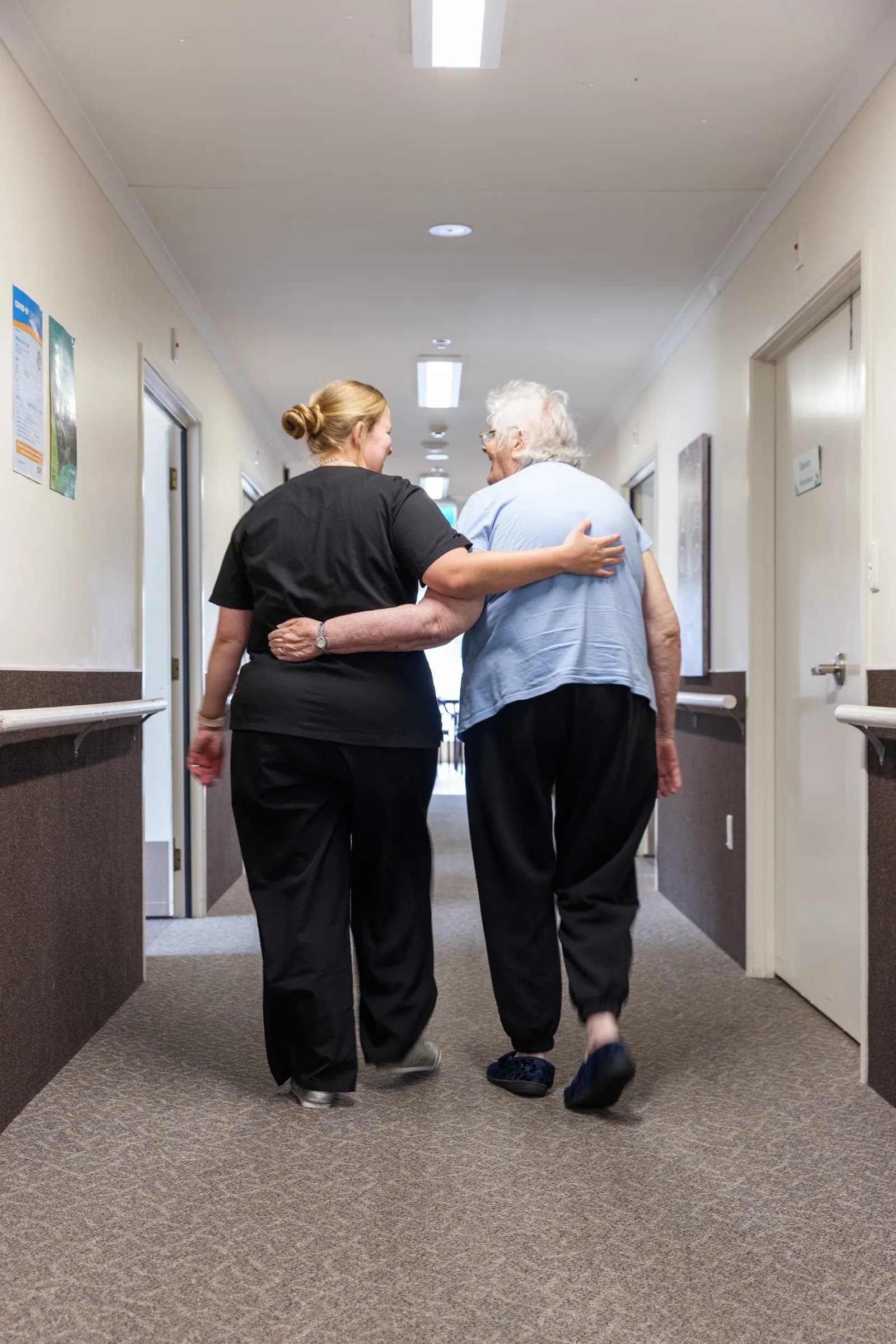 A team member spending time with a resident at Nelson Street