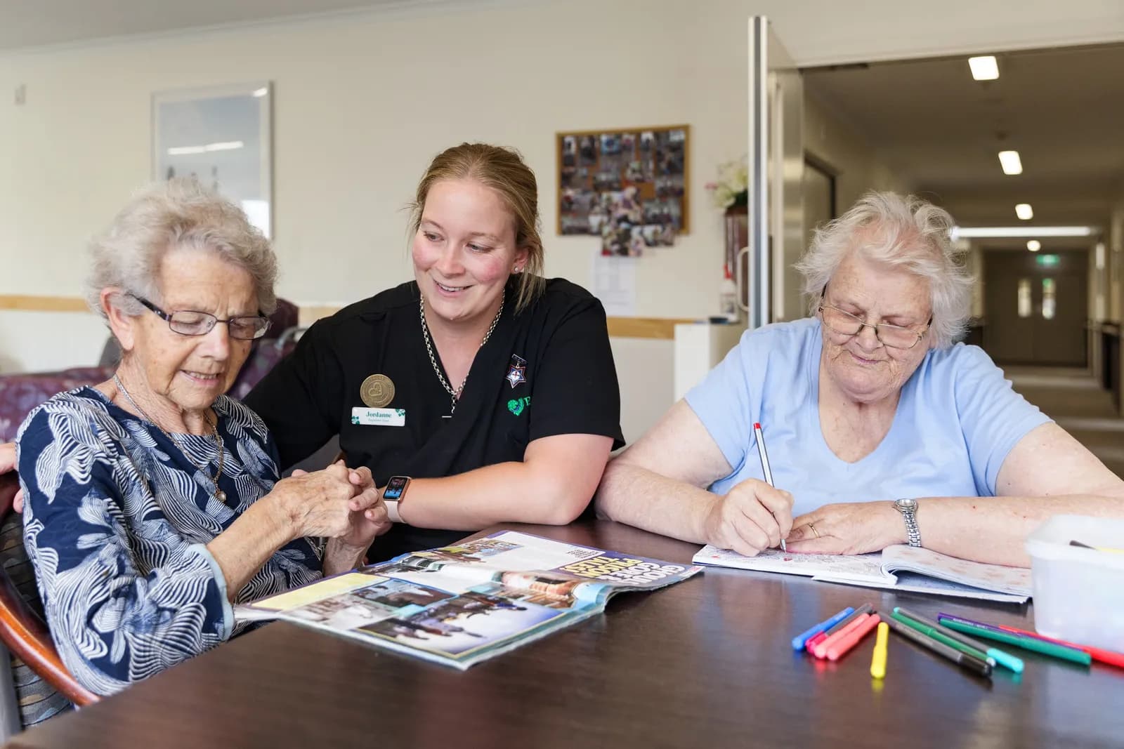 Residents and a team member taking part in an activity at Nelson Street