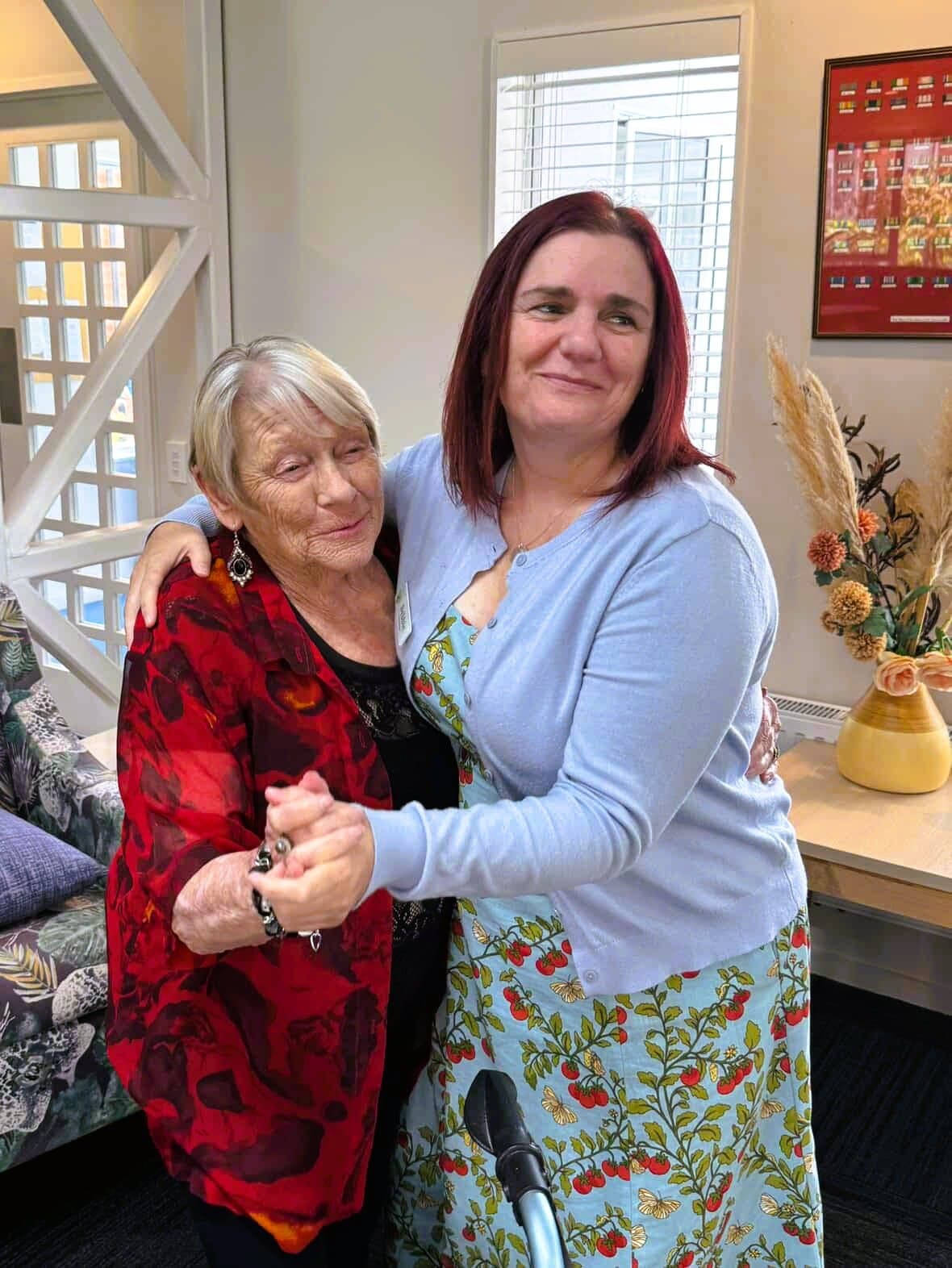 Debbie sharing a dance with a resident at Aldwins House