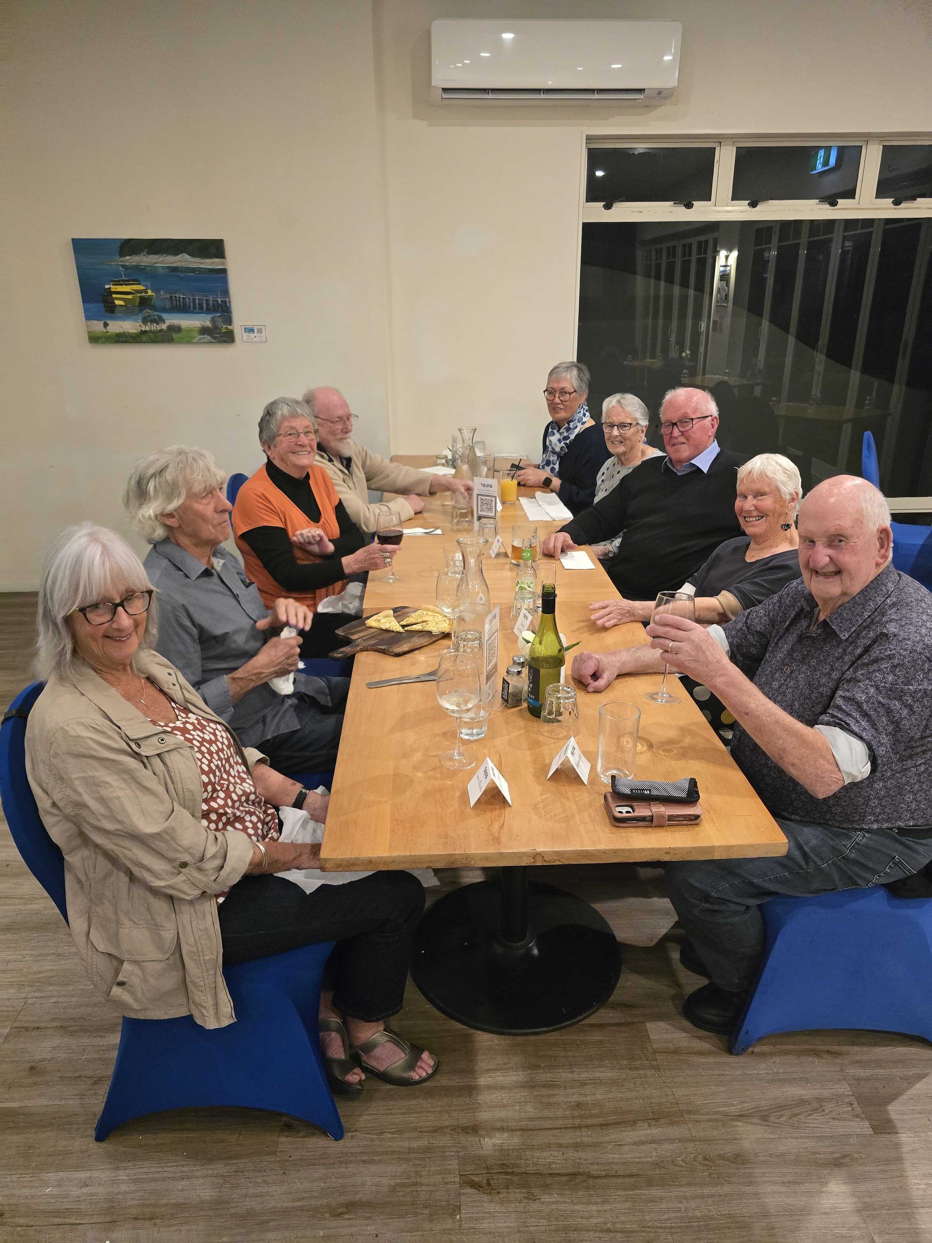 Promisia Beyond travellers sharing dinner together