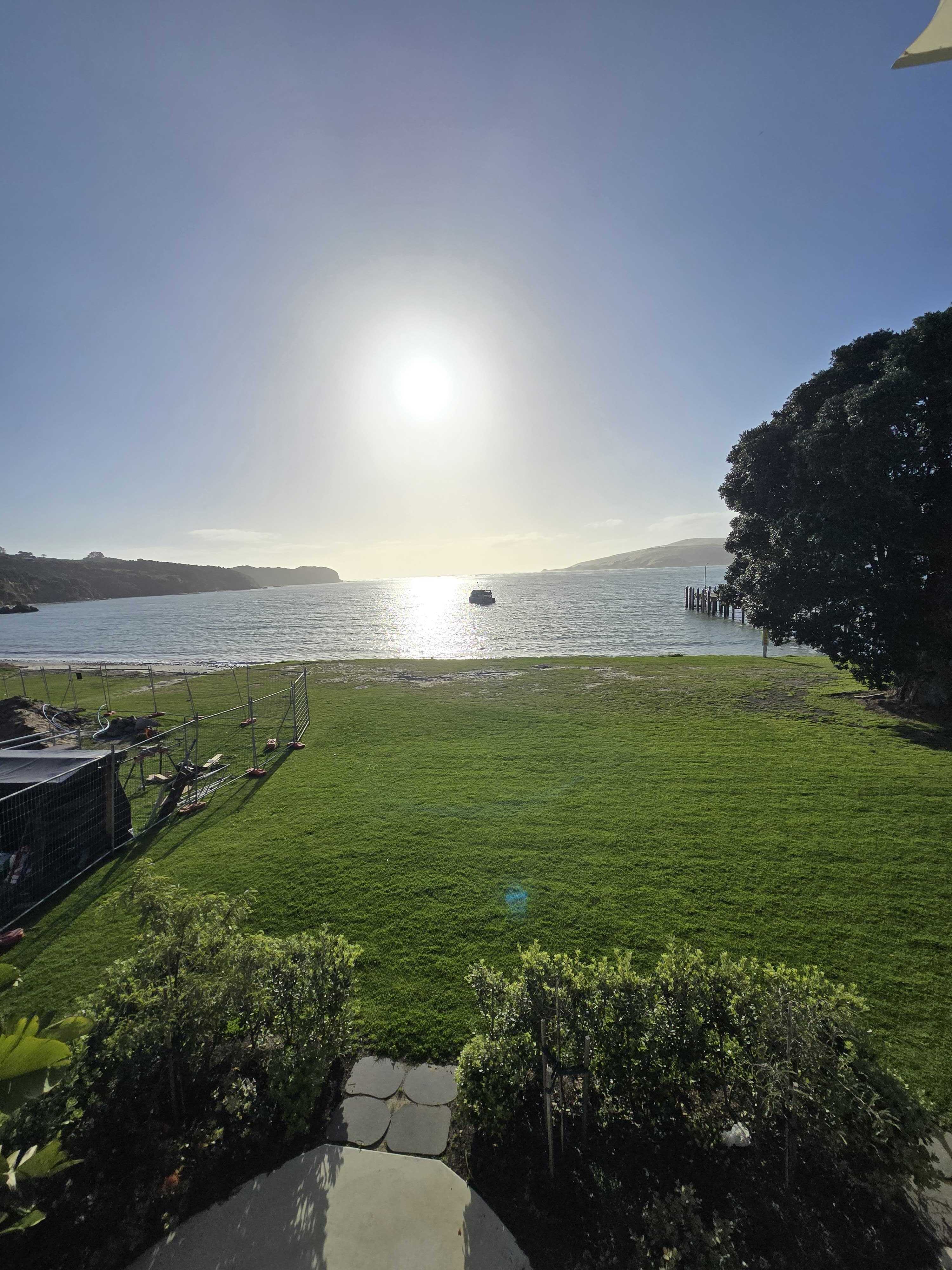 Late afternoon sunshine over a Northland bay
