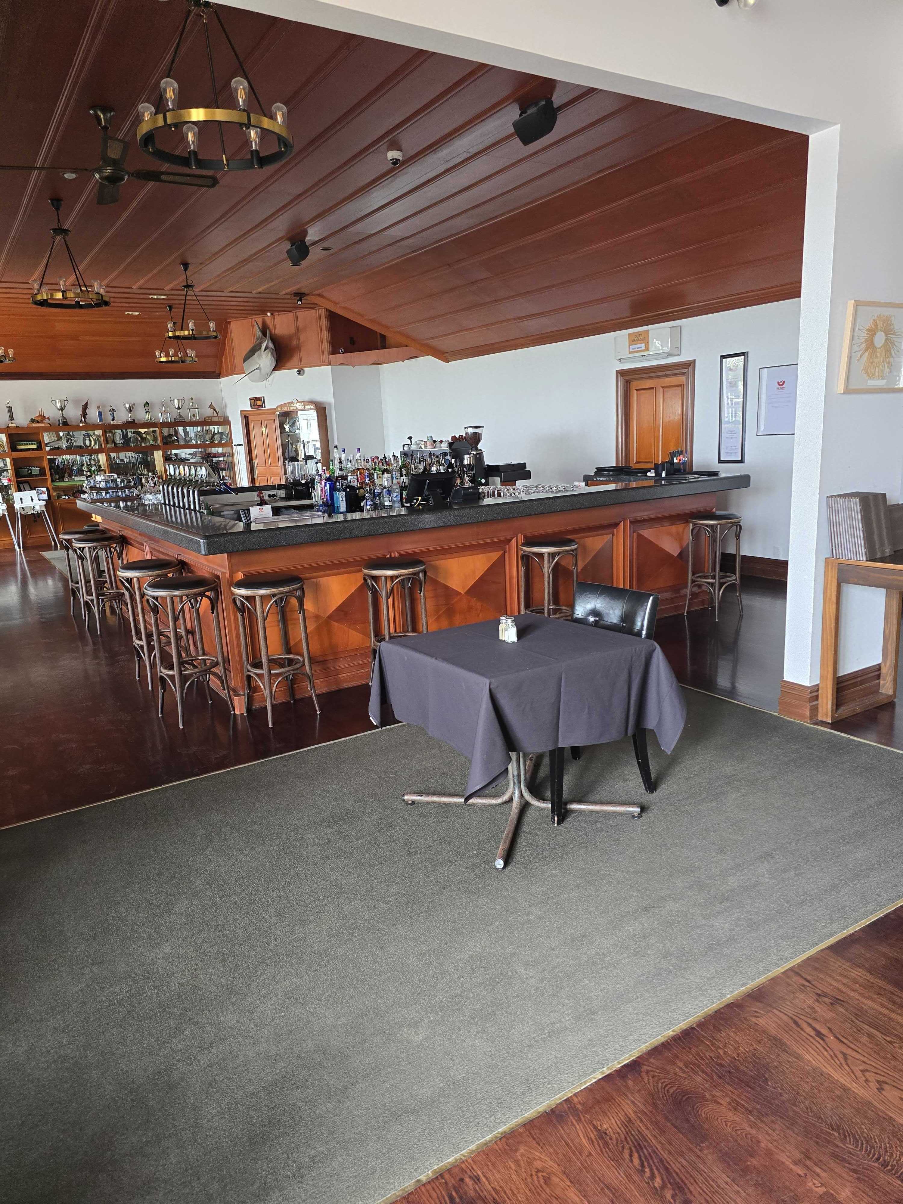 A warm timber-lined venue visited during the journey