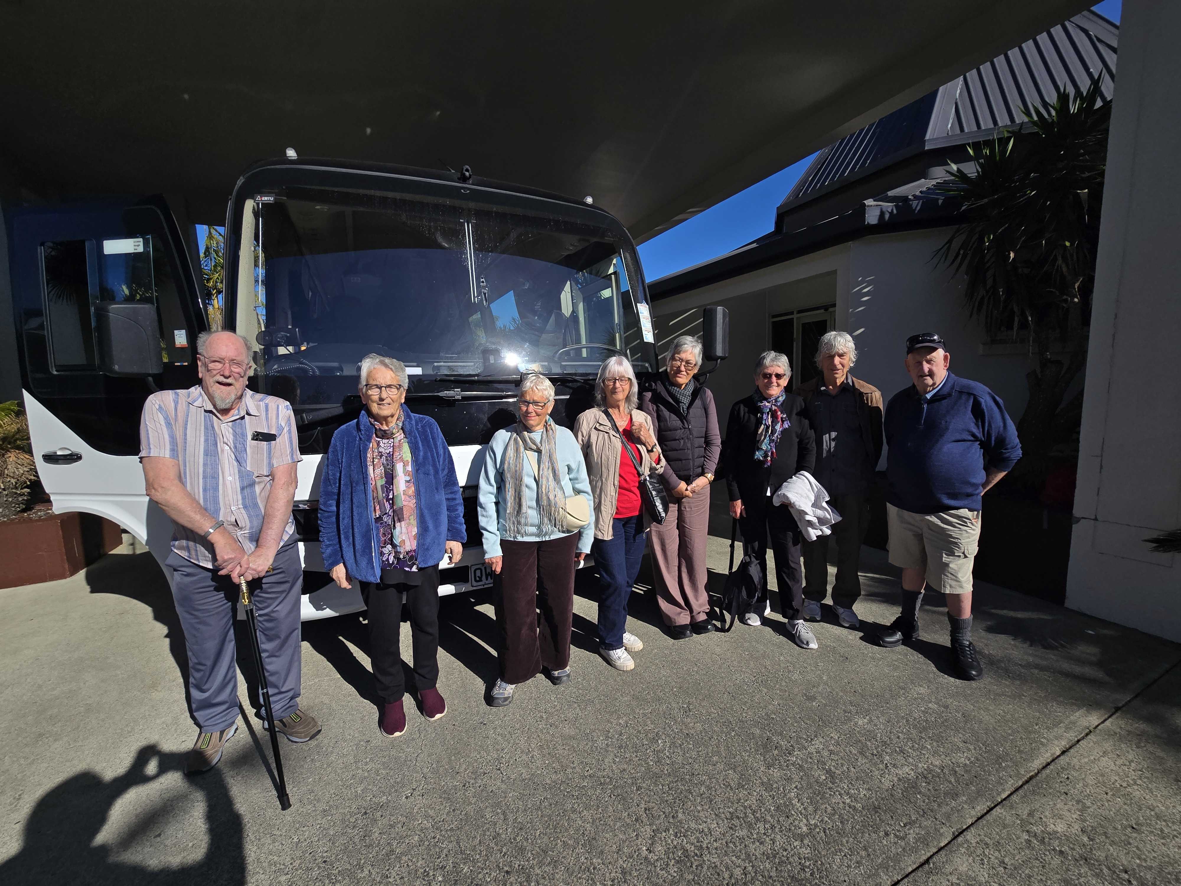 Promisia Beyond travellers gathered beside their tour coach