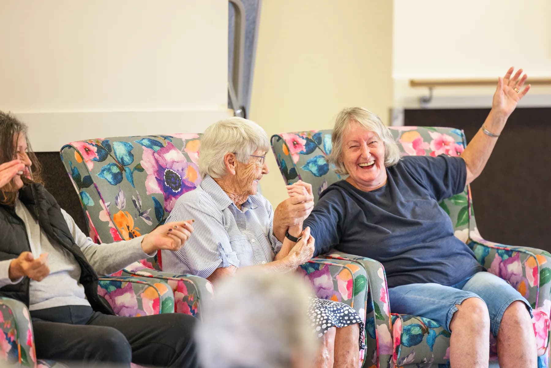 Ranfurly Manor residents enjoying time together in a colourful lounge