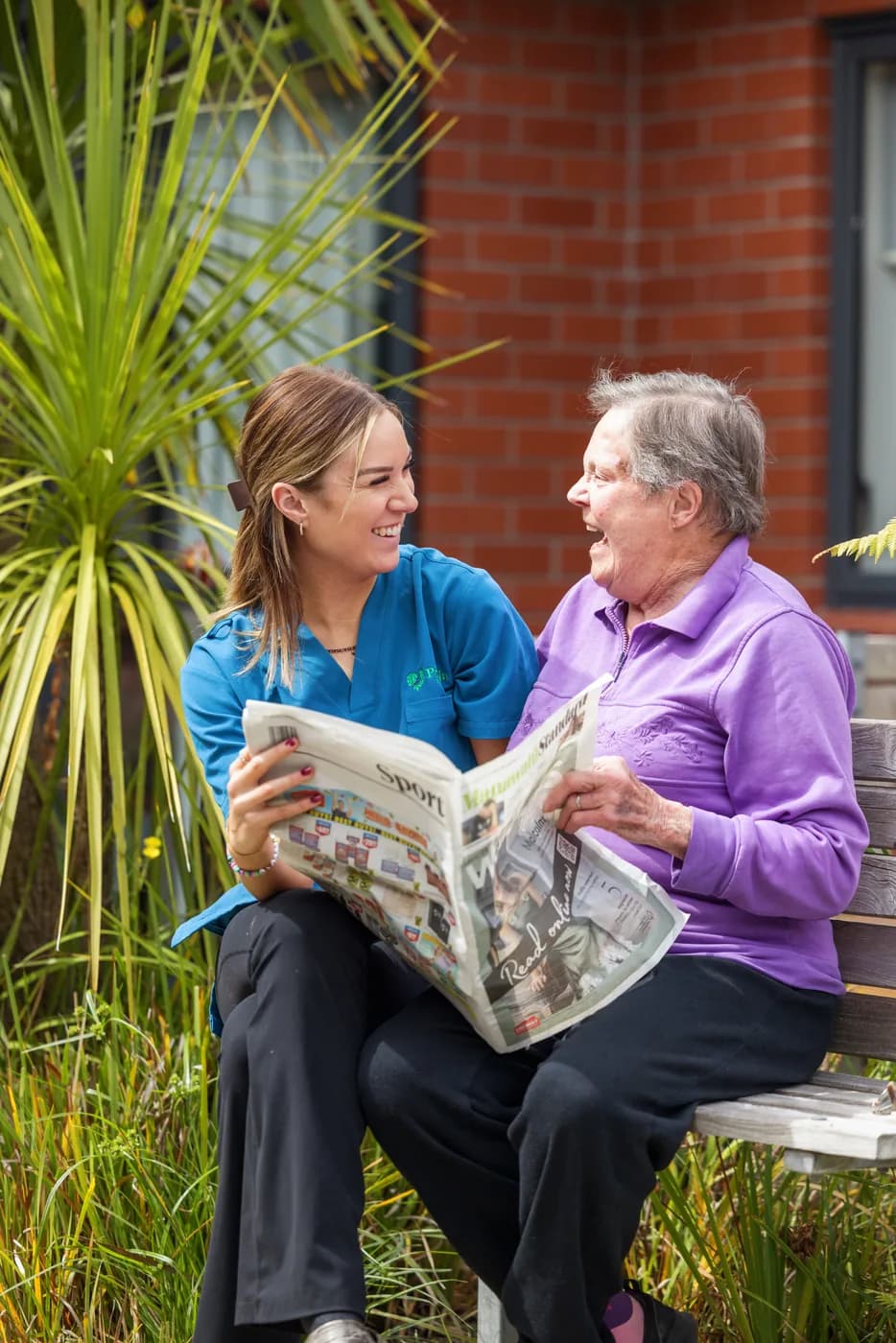 A team member spending time with a resident at Ranfurly Manor